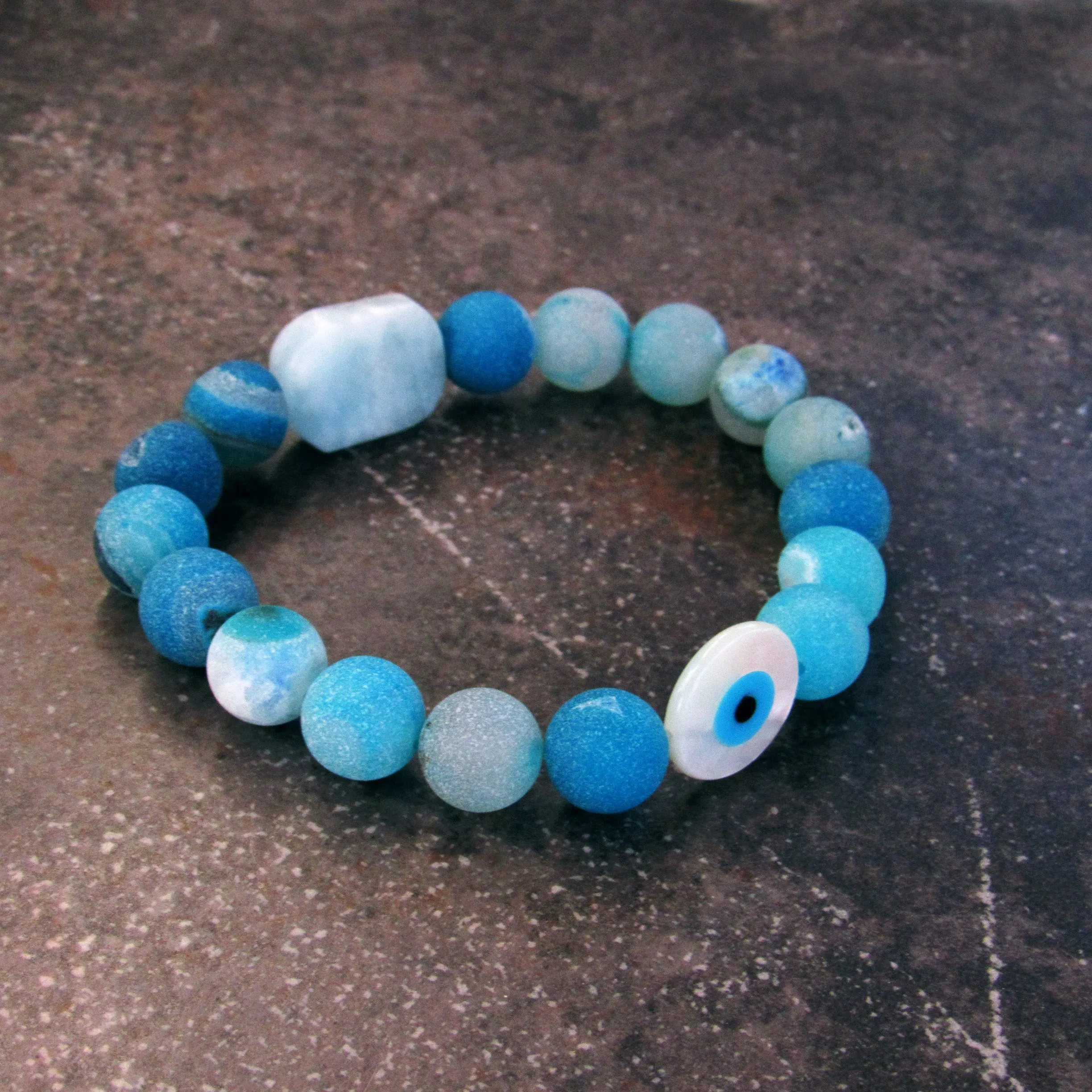 Blue Agates, Aquamarine gemstone, and mother of Pearl Evil Eye Bracelet